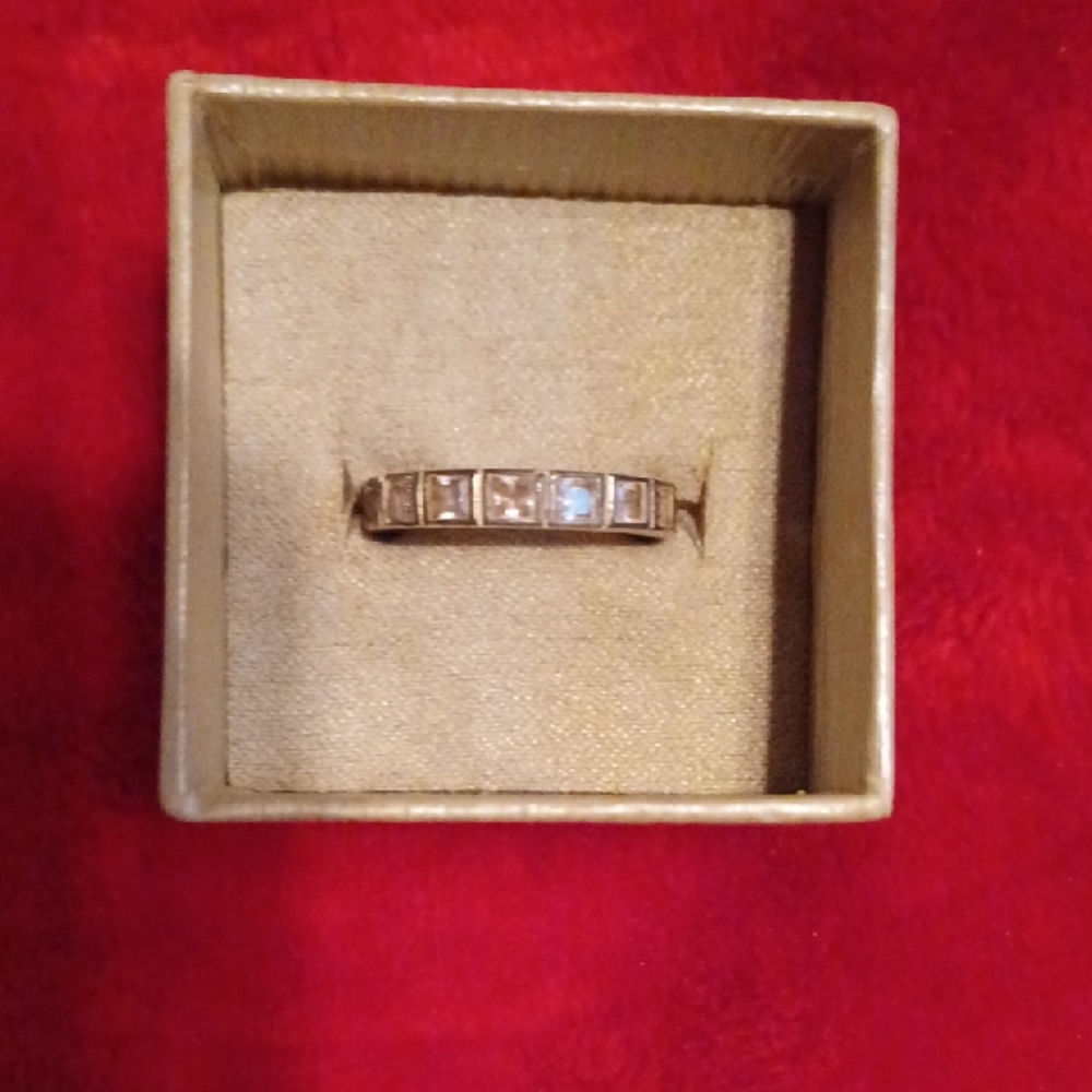 Sterling Silver Eternity Band Ring With Princess Cut Faux Pink Diamonds.